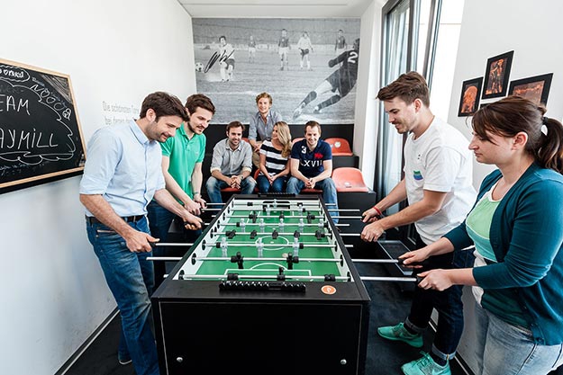 The PAYMILL team playing table soccer
